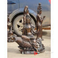 bronze kwan yin statue sitting on fish sculpture